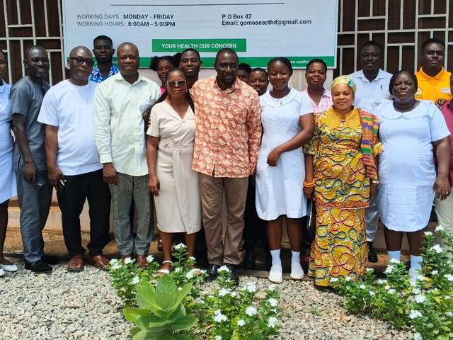 HERO Network staff and Gomoa East District Health Directorate team standing together outside the district office
