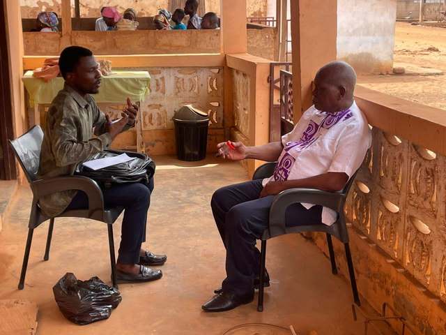 A HERO Network volunteer conducting TB sensitisation and screening at Adzintem Methodist Church